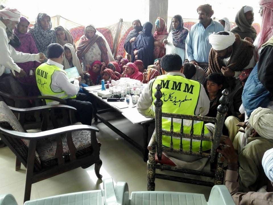 Muslim Medical Mission doctors conducting outpatient consultations and providing free medicine at a rural camp