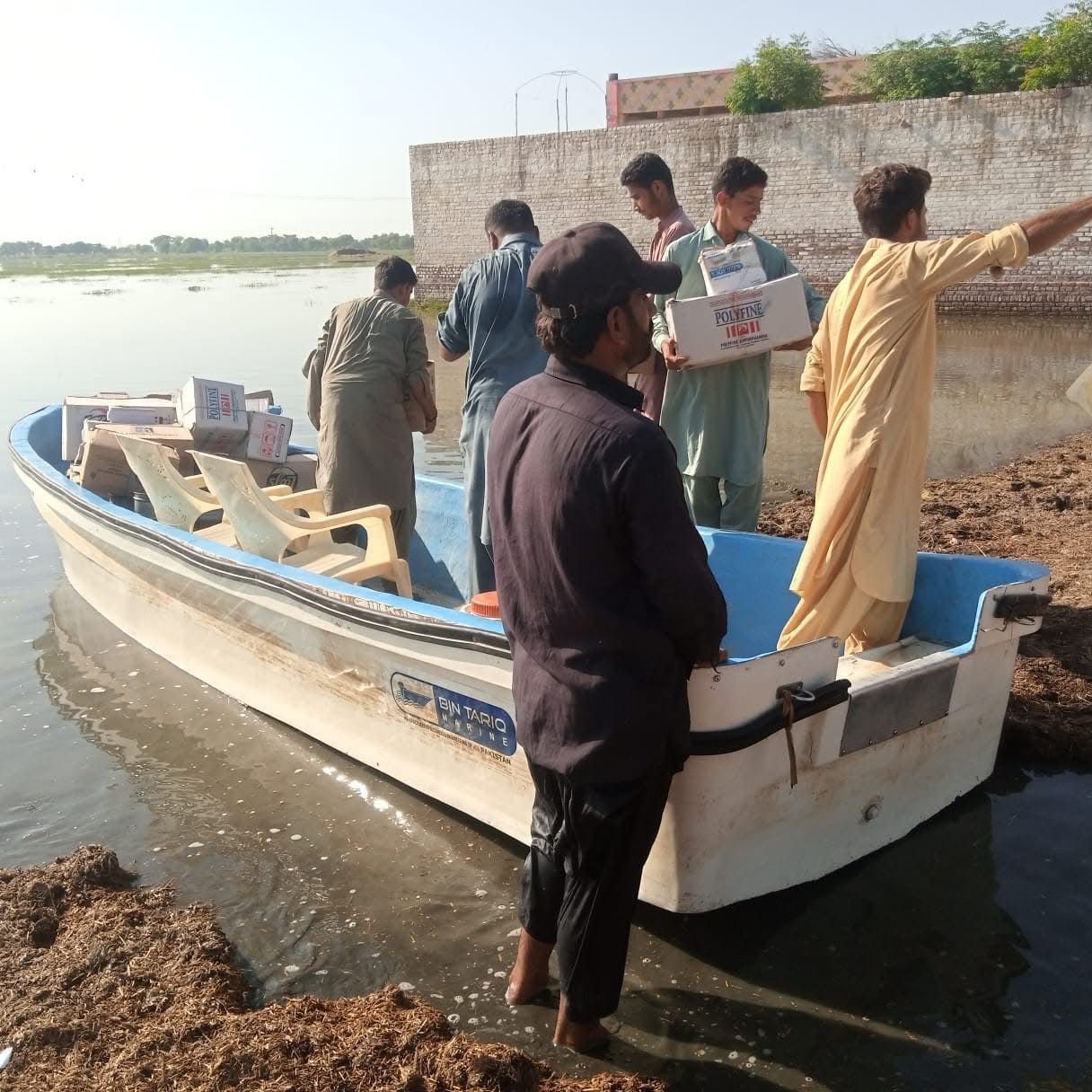 Muslim Medical Mission emergency rapid response team navigating flood waters to deliver medical aid